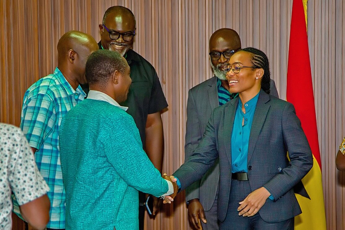 The Minister engages with participants during the meeting.