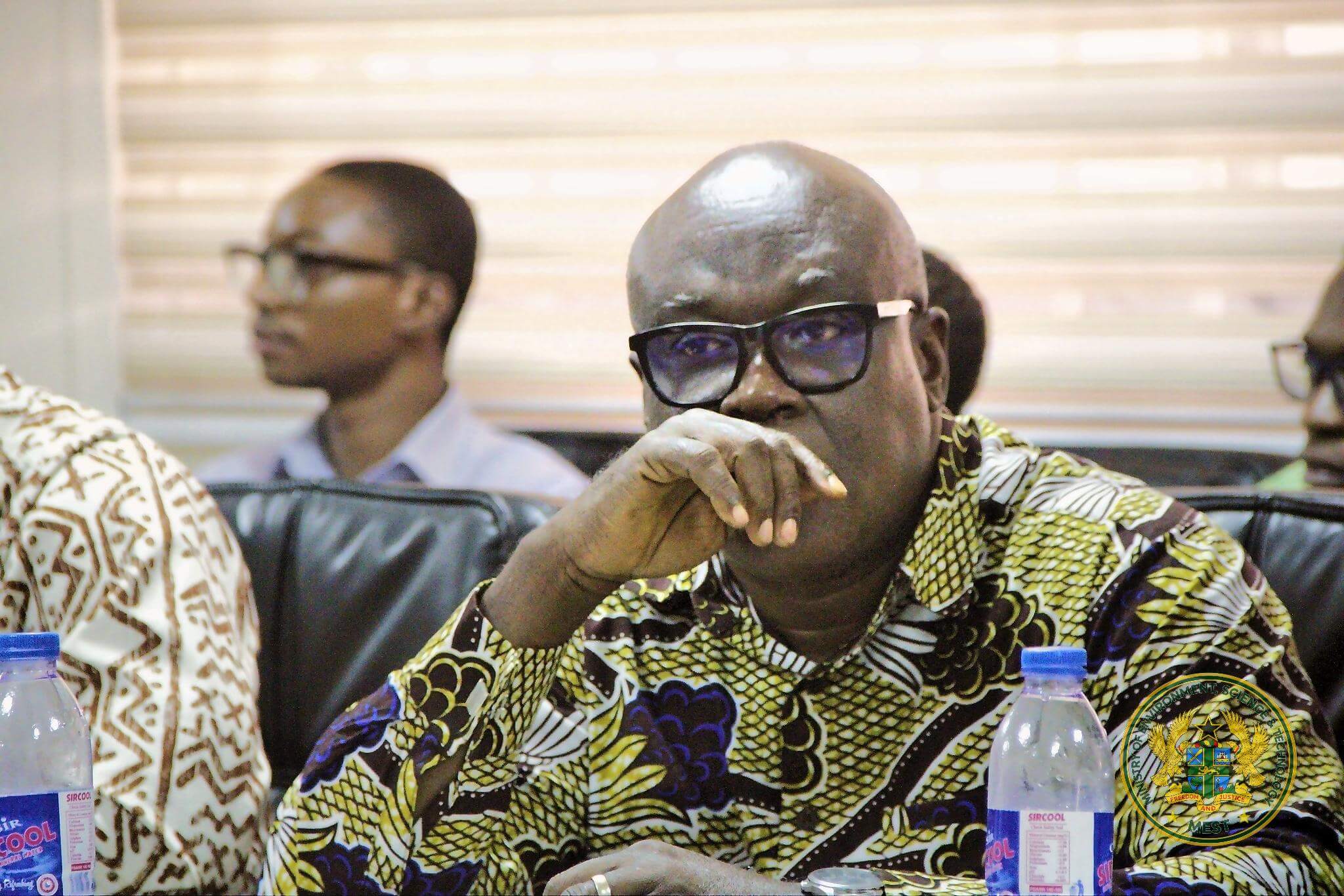 Negotiators listen as the Minister speaks during the meeting.