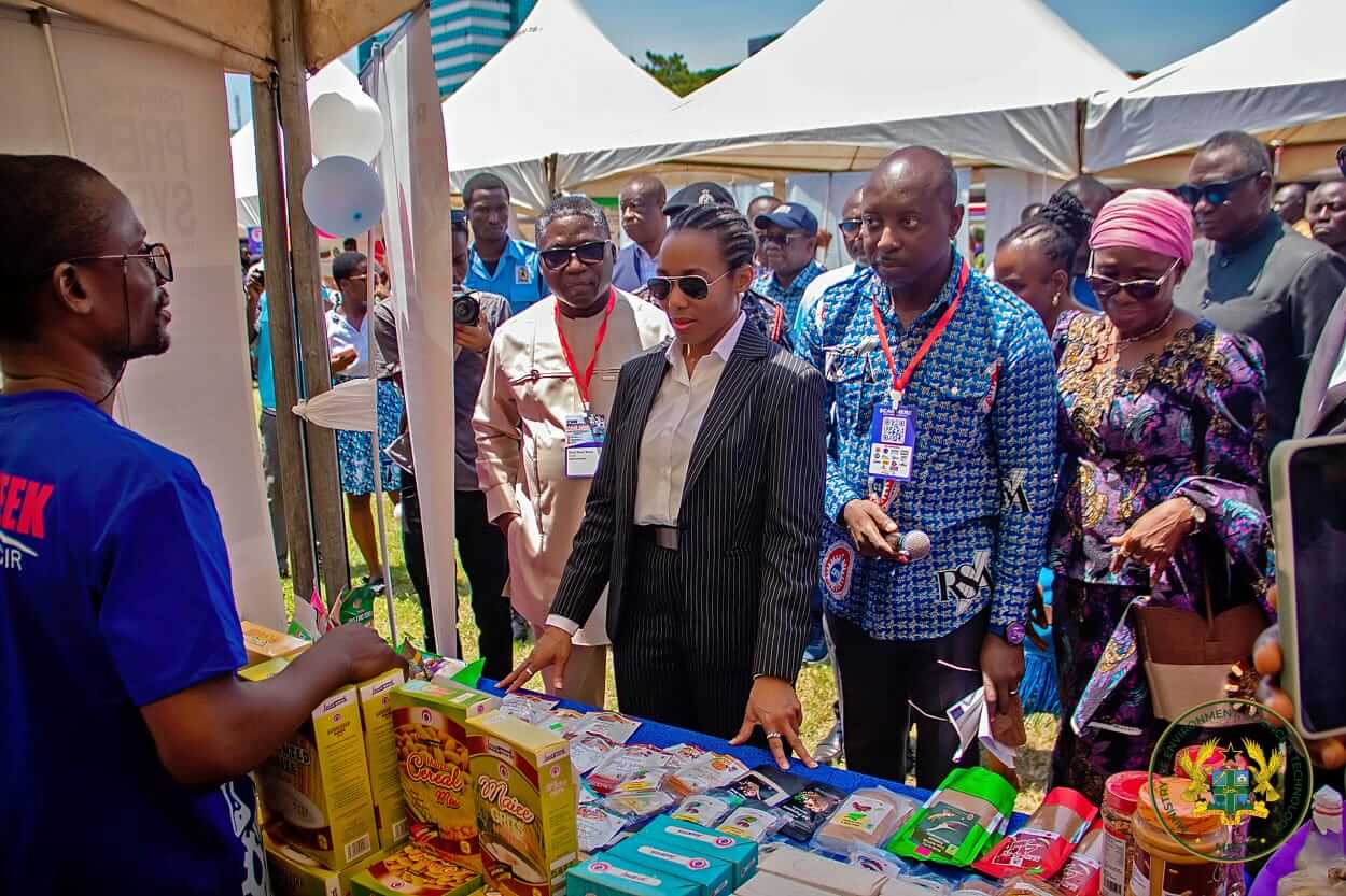 The Minister tours exhibition stands at the fair.