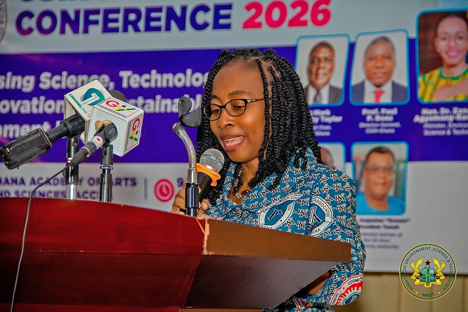 A speaker addresses participants at the conference.
