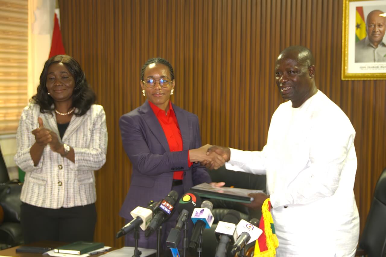 Hon. Armah-Kofi Buah presents the official handing-over documents to Hon. Dr Zanetor Agyeman-Rawlings.